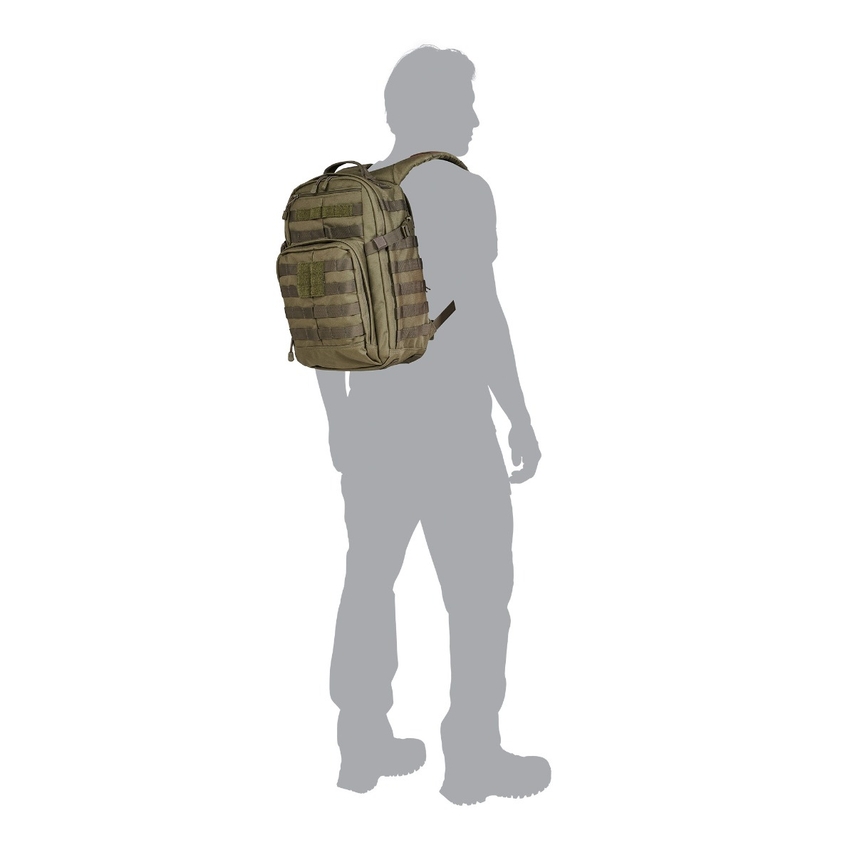 A person standing with a backpack on their back.