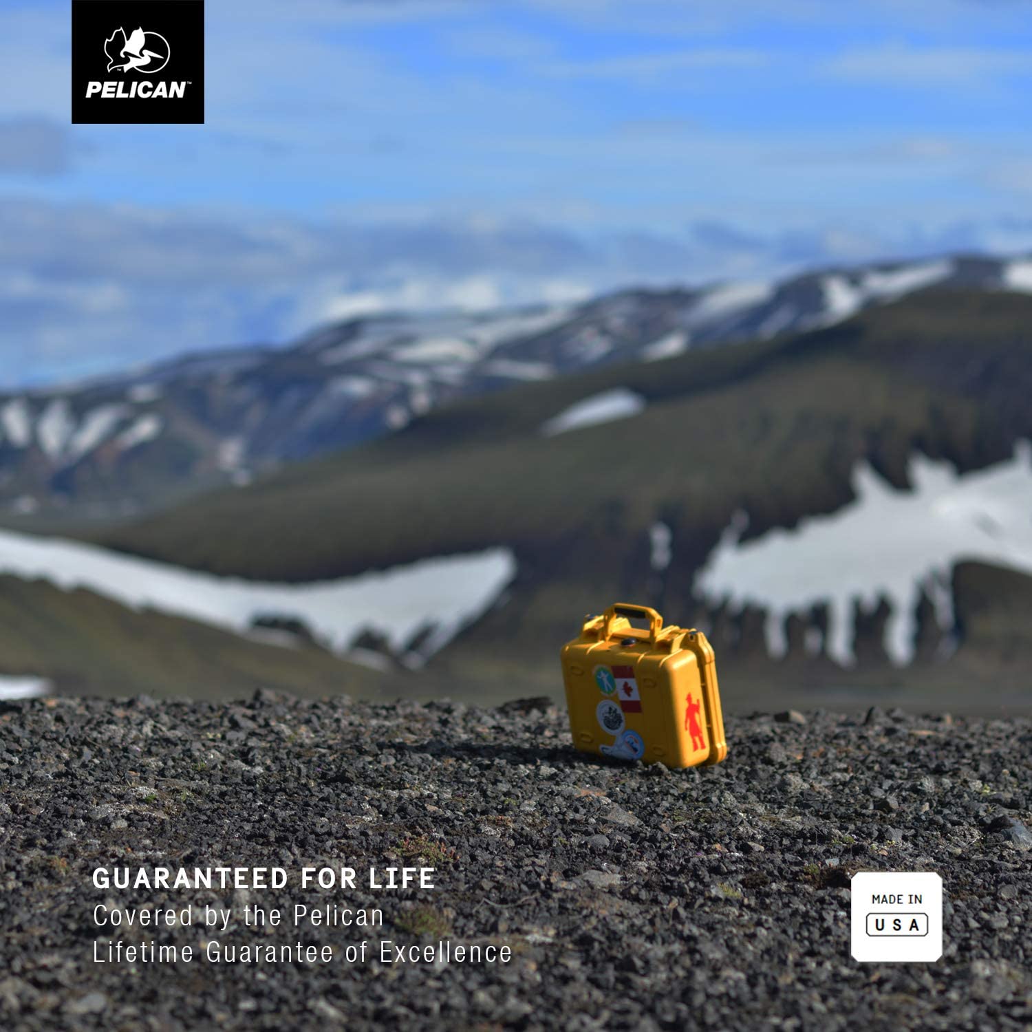 A yellow suitcase sitting on top of a mountain.