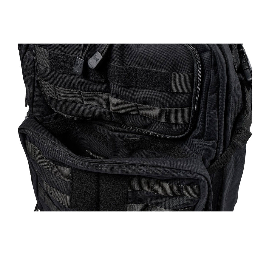 A black backpack with many pockets on it.