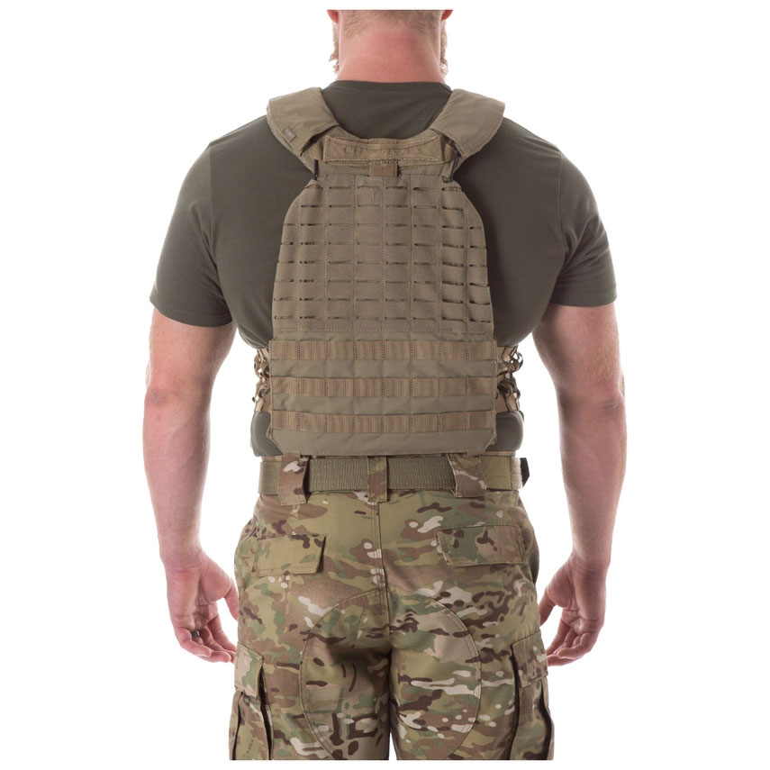A man wearing a multicam vest and shirt.
