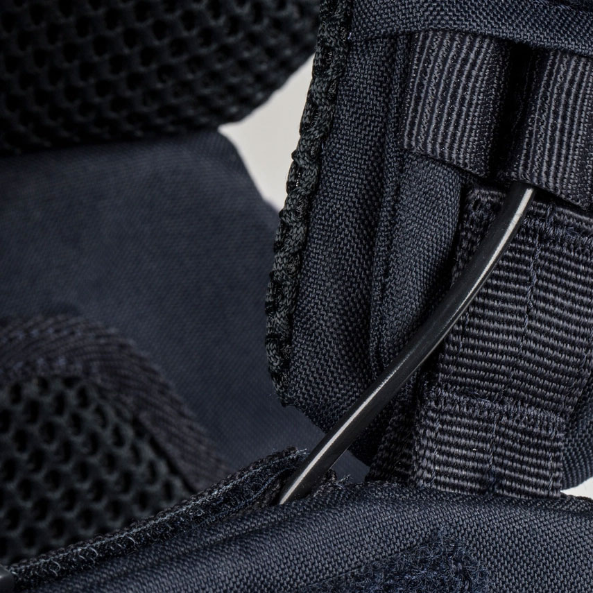 A close up of the stitching on a black bag