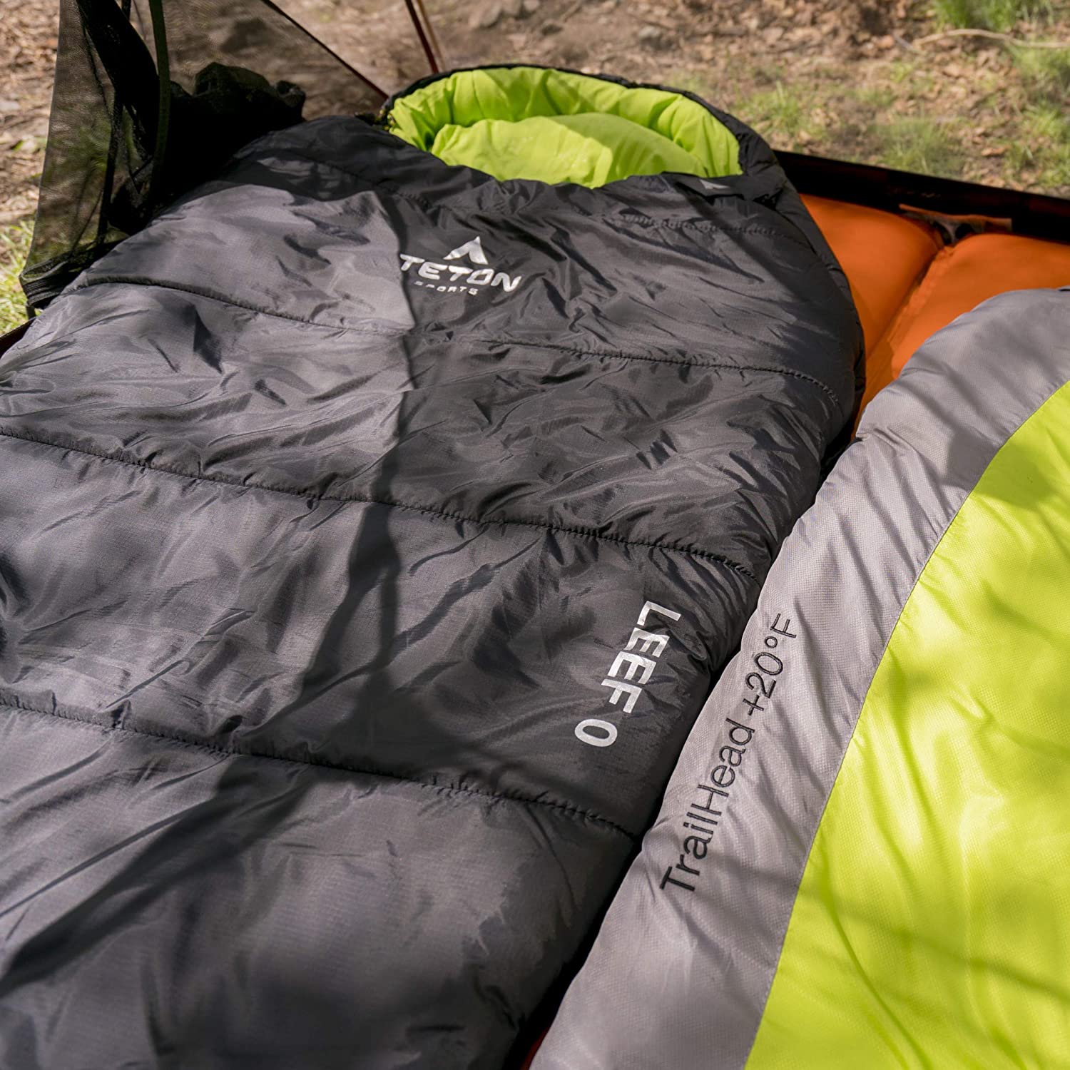 A sleeping bag is laying on the ground.