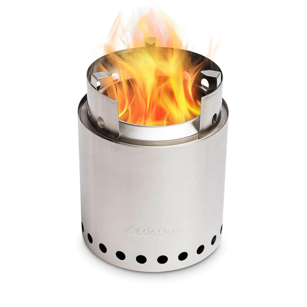 A small stove with flames on top of it.