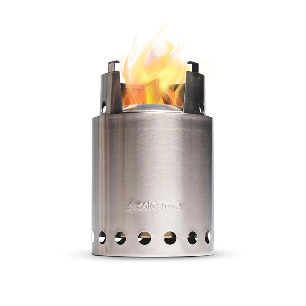 A stainless steel stove with fire burning inside.